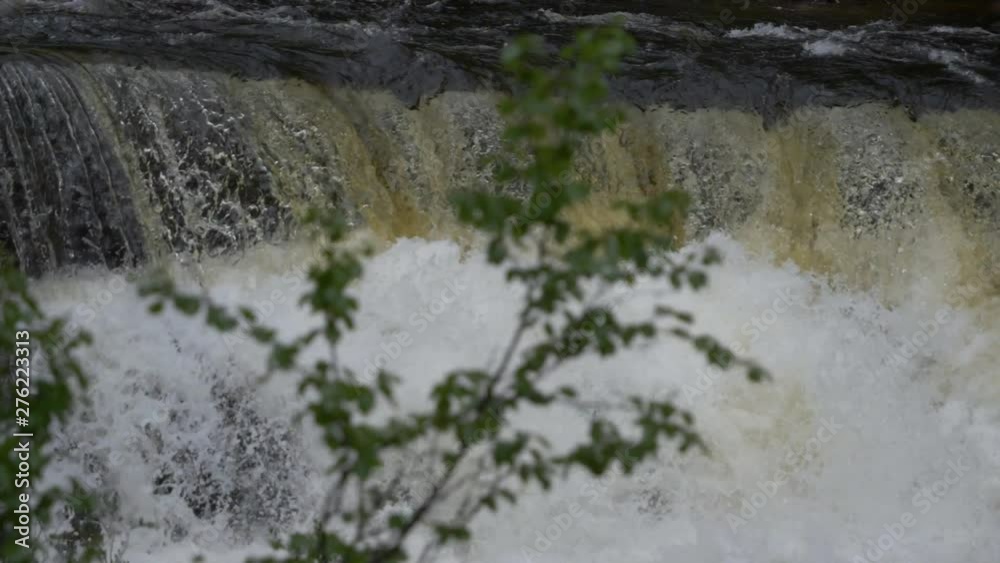 Slow motion shot of an abundant waterfall in a forest. Slow motion shot of an abundant waterfall in a forest.