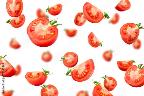 Falling tomato isolated on white background, selective focus