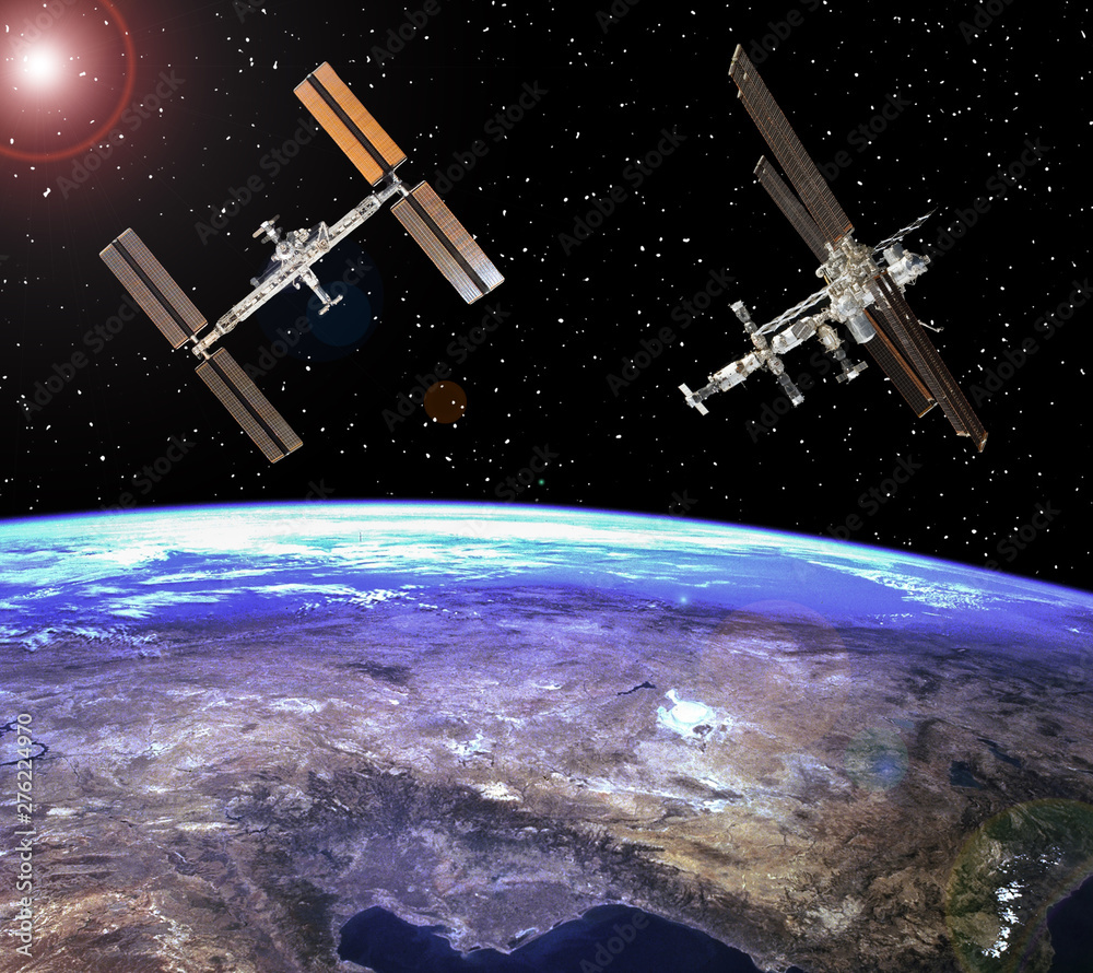 Space station. Spaceships above the earth. The elements of this image furnished by NASA. Space station. Spaceships above the earth. The elements of this image furnished by NASA.