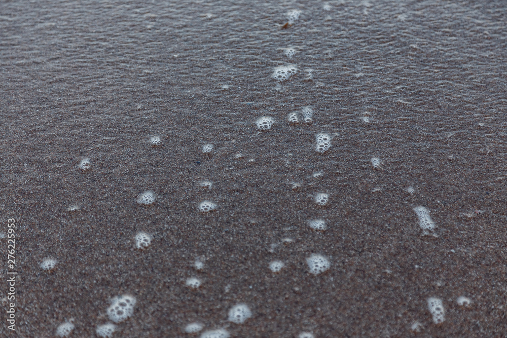 Light sea wave of the evening tide. Close up.