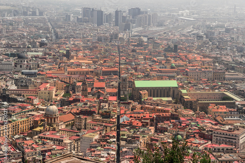 View of Spaccanapoli street splitting city center of Naples. Napoli city skyline with historical Old town, Spaccanapoli street and modern financial district skyscrapers, Italy. photo