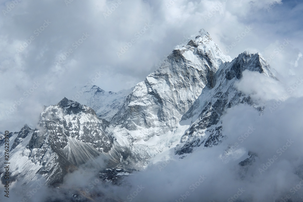 View of fogy Ama Dablam  in the clouds on the way to Everest Base Camp, Nepal