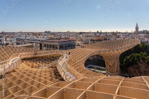 Setas de Sevilla, Metropol Parasol a huge wooden modern architecture structure with Seville historic buildings in the background, Seville, Andalucia, Spain photo
