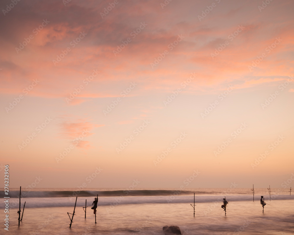 Stilt Fishermen at dusk, Weligama, South Coast, Sri Lanka Stilt Fishermen at dusk, Weligama, South Coast, Sri Lanka