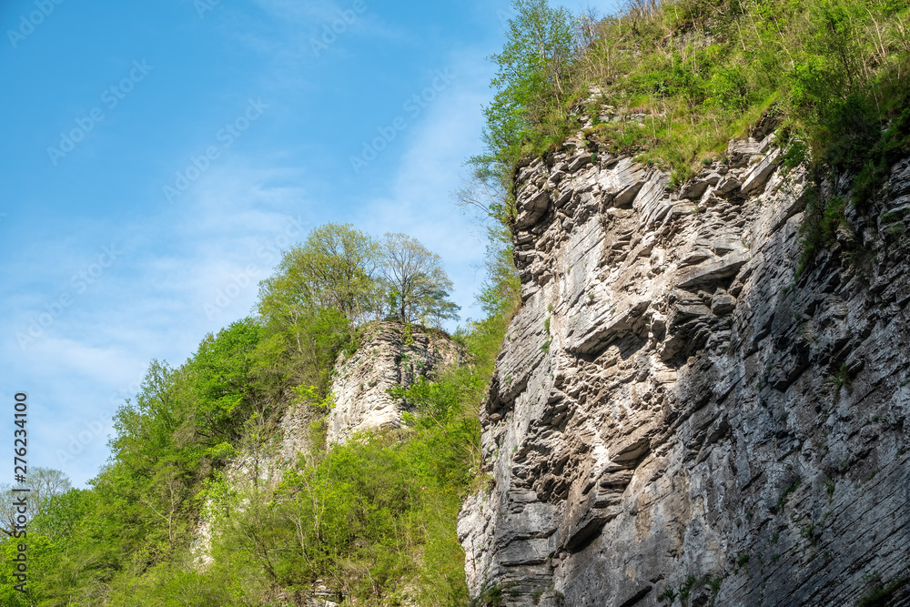 The rock of layered stone is illuminated by the sun. The rock of layered stone is illuminated by the sun.