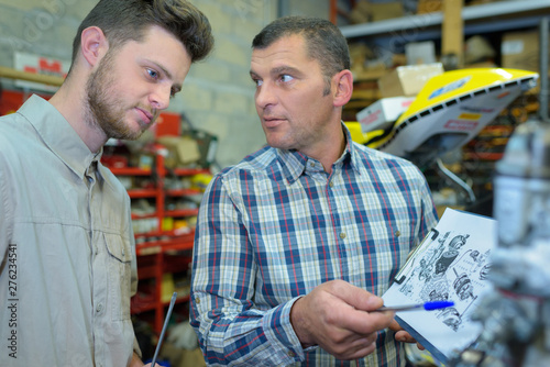 future mechanical engineer studying bluprint