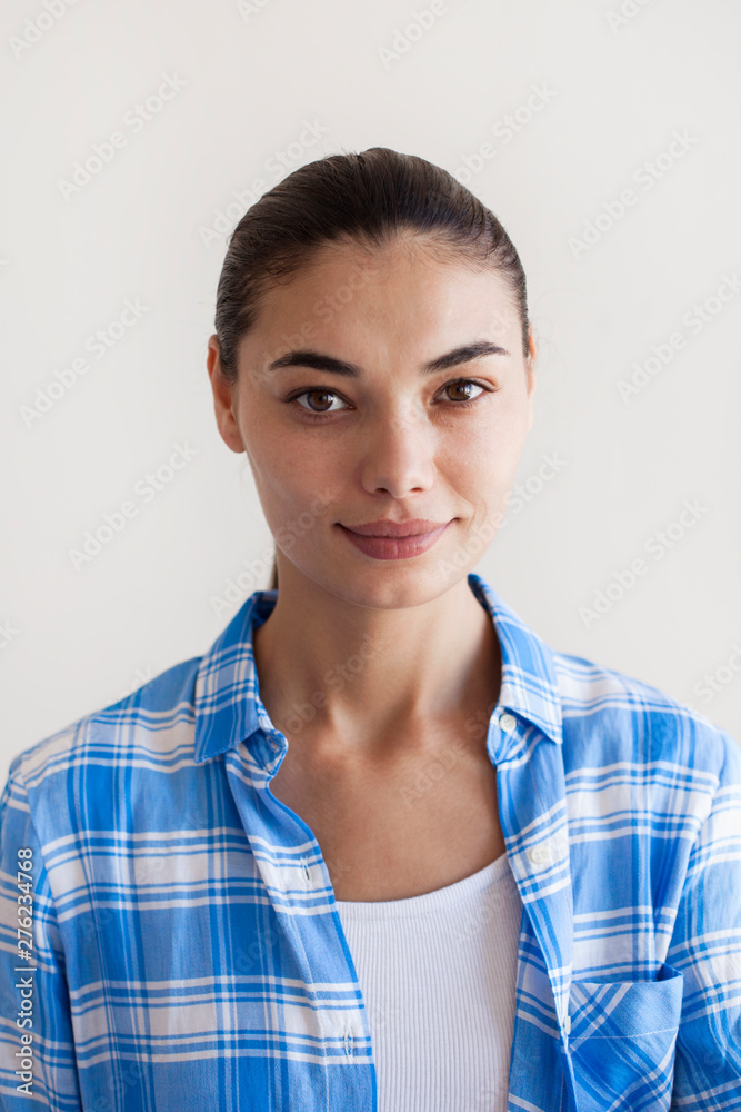 Portrait of beautiful woman smiling at the camera Portrait of beautiful woman smiling at the camera