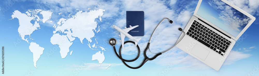 international medical travel insurance concept, stethoscope, passport, laptop computer and airplane on sky background banner with global map - obrazy, fototapety, plakaty 