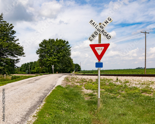 Fotografie, Obraz Rural railroad crossing in the country side with no warning devices such as ligh