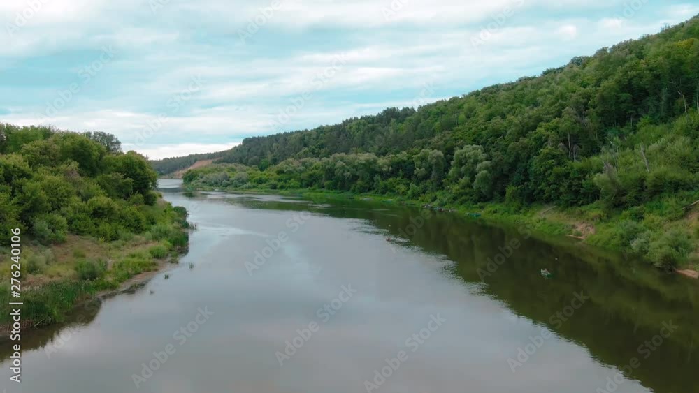 Beautiful aerial 4k view over the curving river along the fields and forest Beautiful aerial 4k view over the curving river along the fields and forest