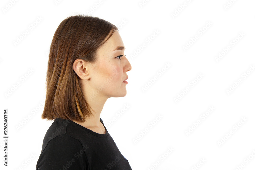 Portrait of the young woman in profile on white background