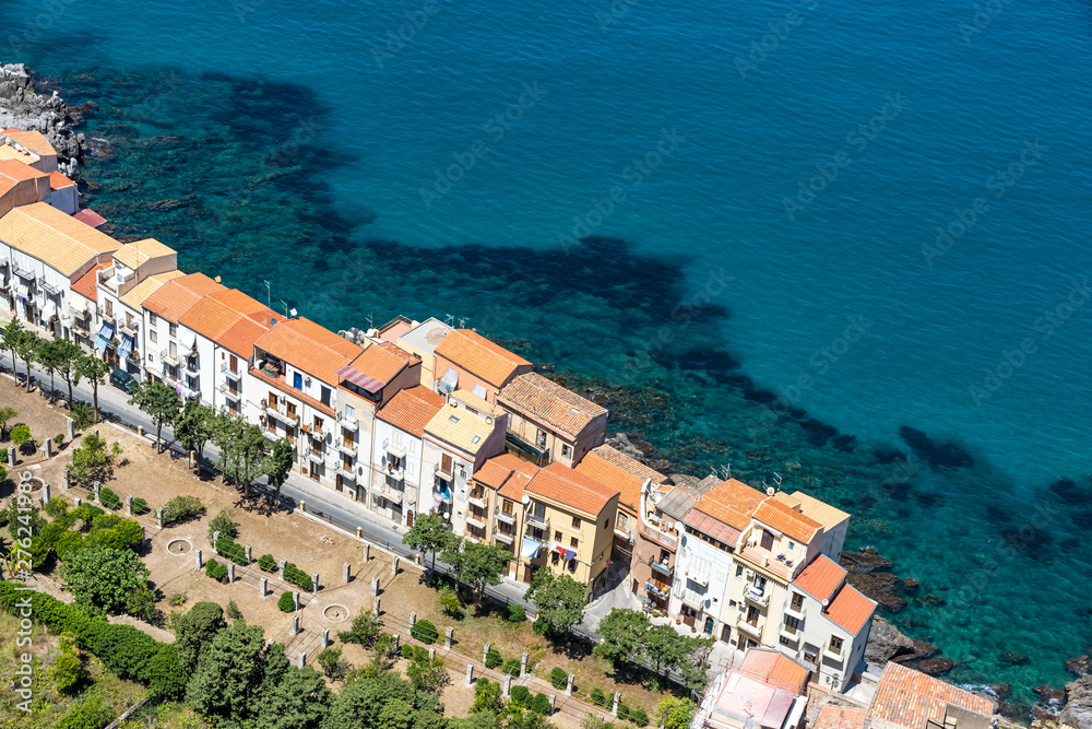 Aerial view of Cefalu old town, Sicily, Italy. Cefalu is one of the major tourist attractions in Sicily. Picturesque view of seashore from Rocca di Cefalu