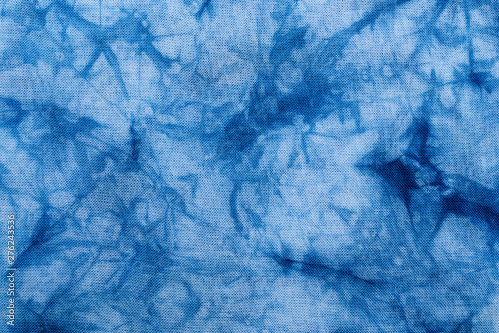 Pattern of blue dye on cotton cloth, Dyed indigo fabric background and textured Pattern of blue dye on cotton cloth, Dyed indigo fabric background and textured