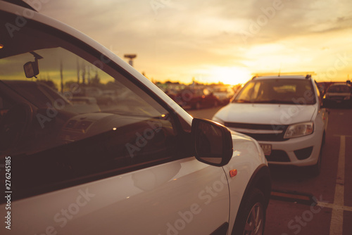 amazing sunset on the car parking in the city, selective focus © Mihail