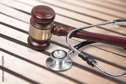 Gavel and stethoscope on background, symbol photo for bungling and medical error