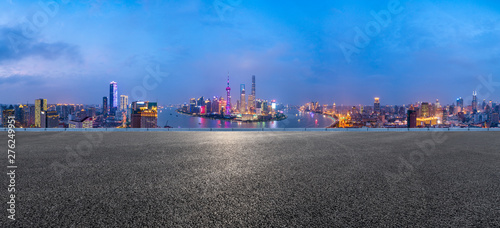 Shanghai skyline panoramic view with asphalt road at night,China