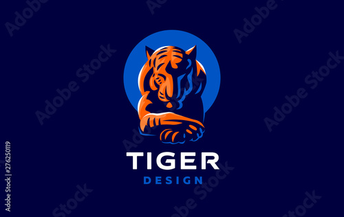 A tiger lies with its head down