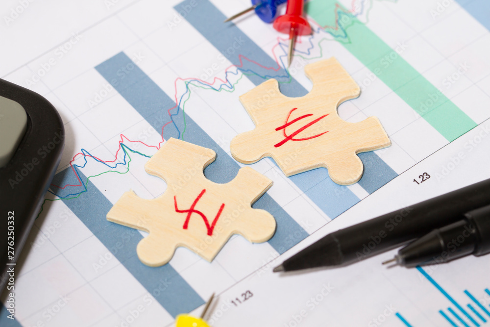 Puzzle and business chart, economic cooperation and success, currency symbol,pound and euro Puzzle and business chart, economic cooperation and success, currency symbol,pound and euro
