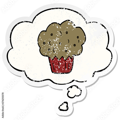cartoon muffin and thought bubble as a distressed worn sticker
