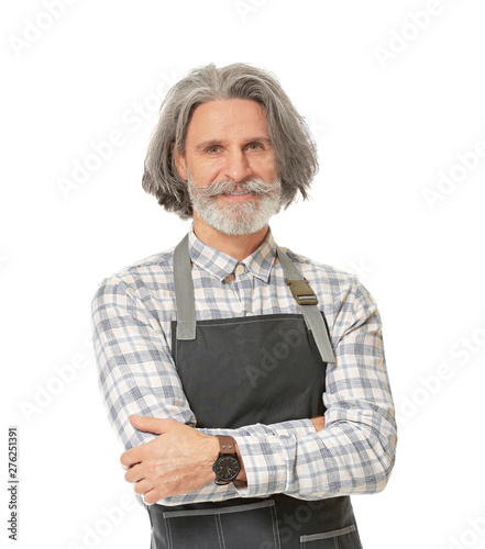 Tableau sur toile Senior man in apron on white background