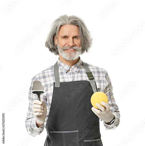 Male owner of cheese store ...