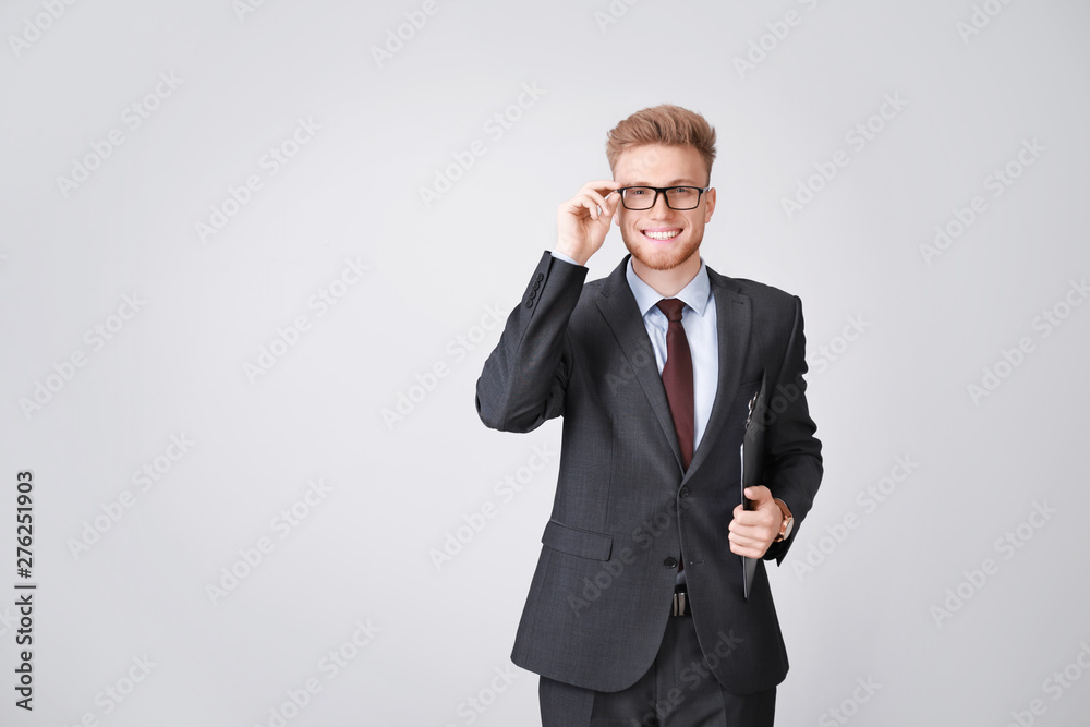Portrait of businessman on light background Portrait of businessman on light background