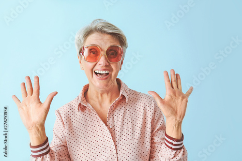 Happy mature woman on color...