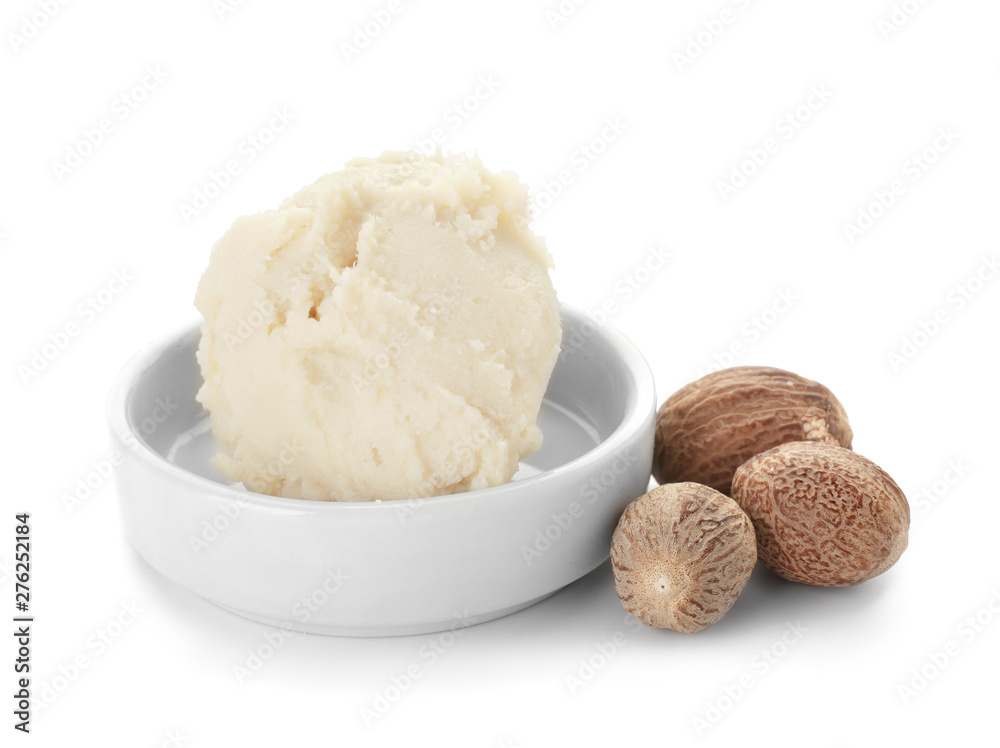 Plate with shea butter on white background