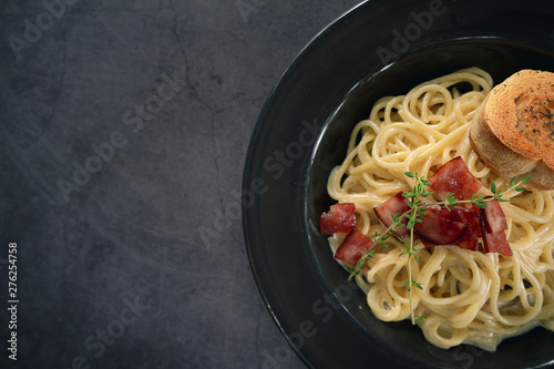 Italian pasta spaghetti dish. Stir-fried spaghetti with chicken, bacon and mushroom.