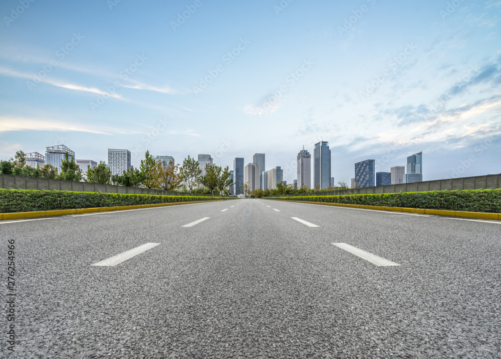 Fototapeta premium city road through modern buildings in beijing.
