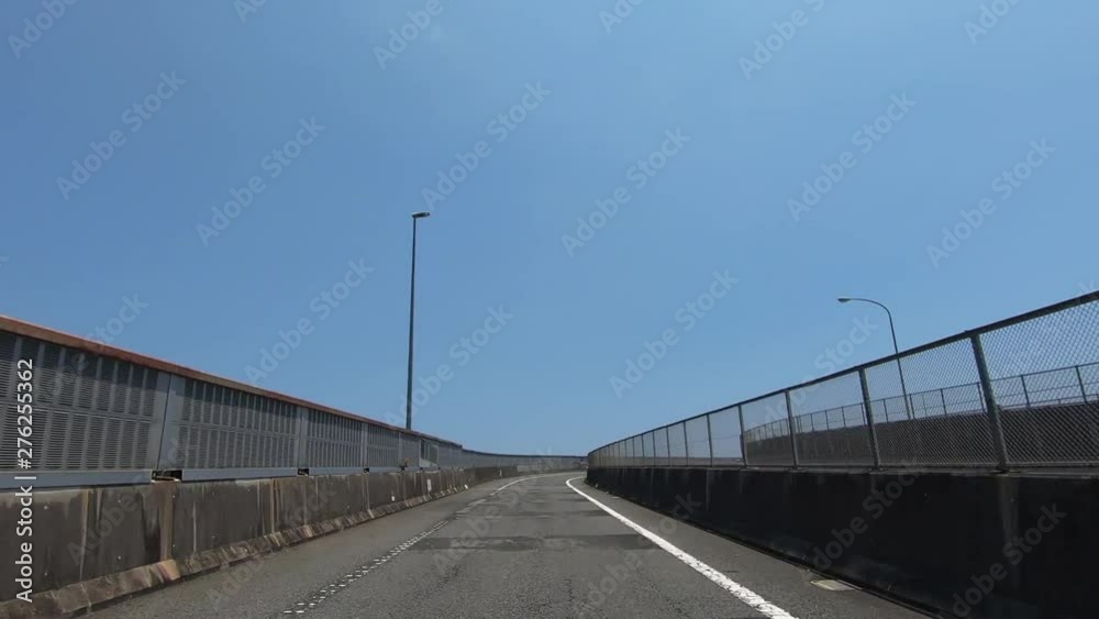 Driving picture of the curve where the sea can be seen