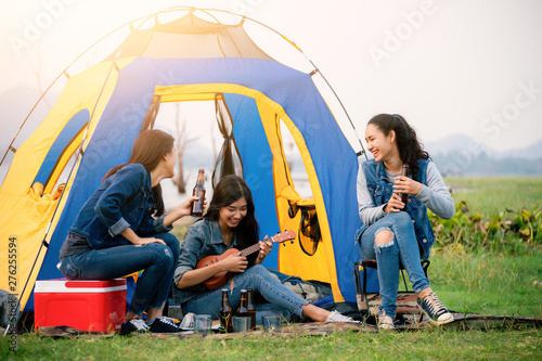 A group of girls that they are camping in the forest.