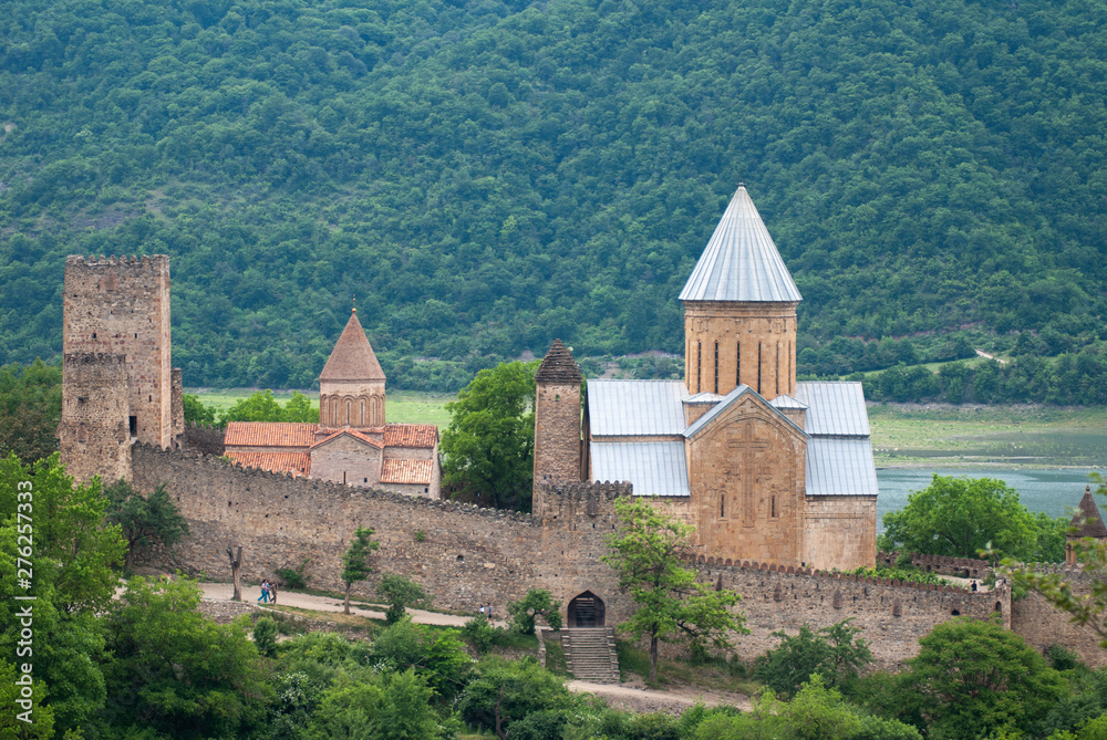 The old Church and fortress of Ananuri, a fortress on a background of mountains,