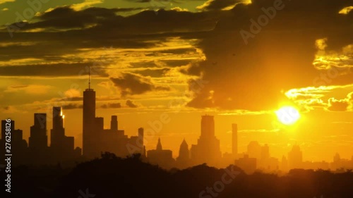 Wide shot of downtown Manhattan during sunset with heavy layers of clouds