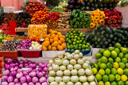 Group of colorful fruits and vegetables at a market stall