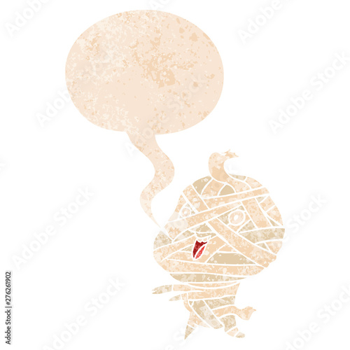 cartoon halloween mummy and speech bubble in retro textured style