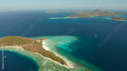 Fototapeta Naklejka Na Ścianę i Meble -  aerial view tropical islands with blue lagoons, coral reef and sandy beach. Palawan, Philippines. Islands of the Malayan archipelago with turquoise lagoons.