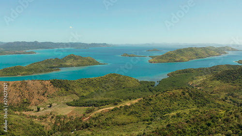 Aerial drone small island group in province of Palawan. Busuanga  Philippines. Seascape  islands covered with forest  sea with blue water. tropical landscape  travel concept
