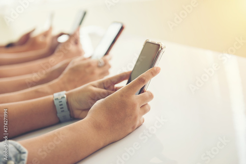 Group of hands people using and looking at mobile phone
