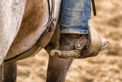 Detail of cowboy boot with spur © Jaroslav Moravcik