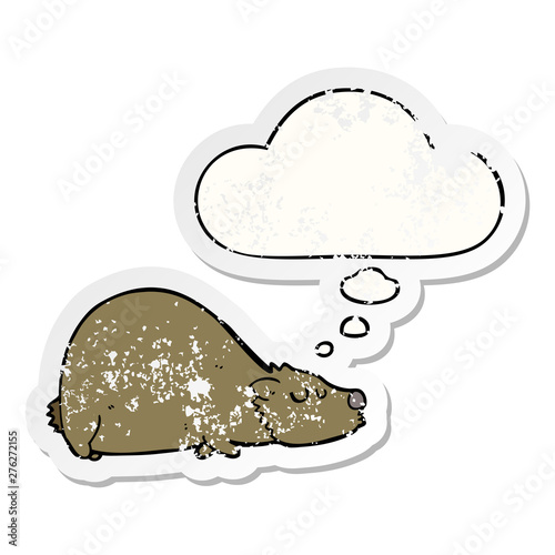 cartoon bear and thought bubble as a distressed worn sticker
