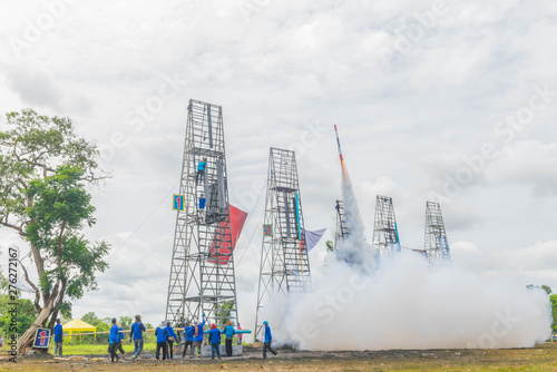 Many people are preparing fireballs, the rocket taking off to the sky, Thailand community rocket festival at Phanom Phrai District, Roi Et Province. photo