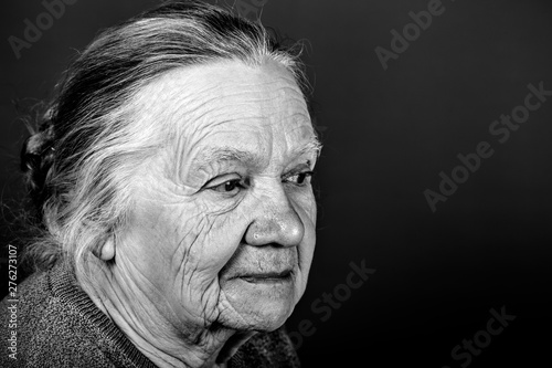 Portrait of elderly woman. Attention. Toned