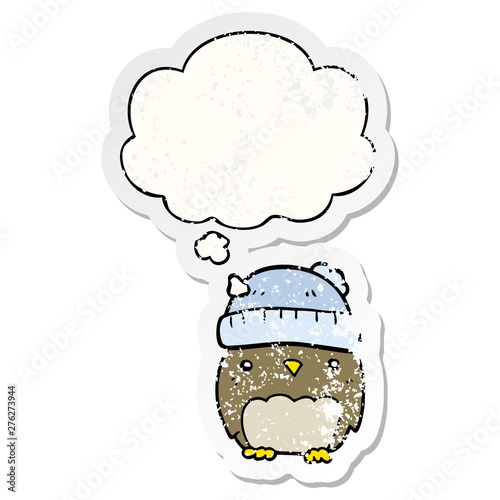 cute cartoon owl in hat and thought bubble as a distressed worn sticker
