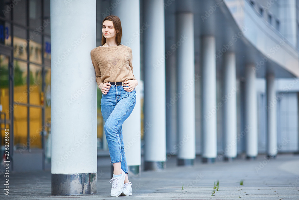 girl in full growth of model appearance demonstrates casual clothes. girl in full growth of model appearance demonstrates casual clothes.