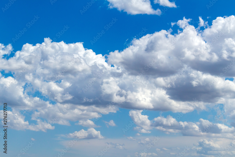 Picturesque beautiful clouds before rain on the blue sky. Weather, nature concept.