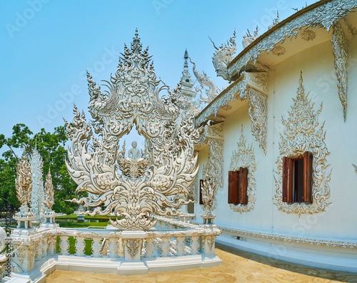 Buddha Image on terrace of White Temple, Chiang Rai, Thailand photo