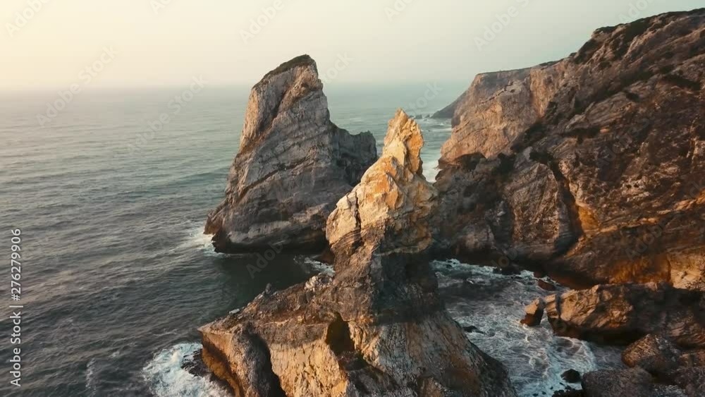 Aerial view of the major central rock at Ursa Beach, Sintra, Portugal. Shot during sunset Aerial view of the major central rock at Ursa Beach, Sintra, Portugal. Shot during sunset