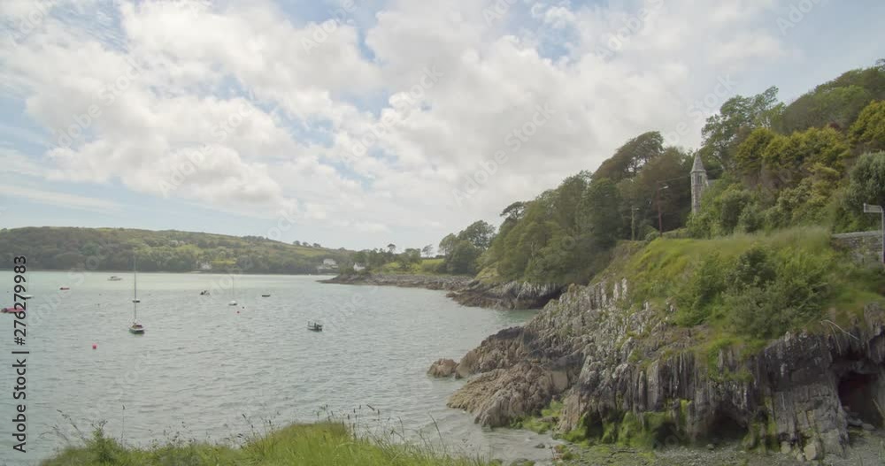 Coastal view of harbour, cliffs, a church and the sea on a sunny summers day 2