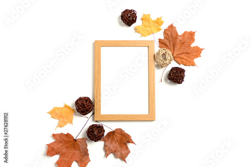 Photo frame mockup with frame made from dry maple leaves and rattan balls on white background